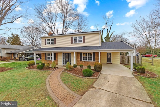 view of front facade featuring a carport and a front lawn