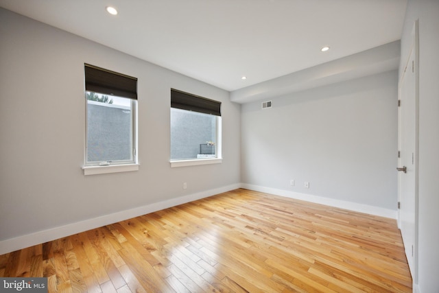 unfurnished room featuring hardwood / wood-style flooring