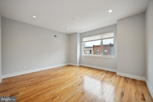 unfurnished room with light hardwood / wood-style flooring