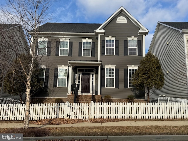 view of front facade with a fenced front yard