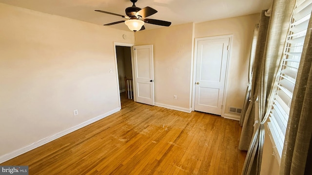 unfurnished bedroom featuring ceiling fan and light hardwood / wood-style flooring