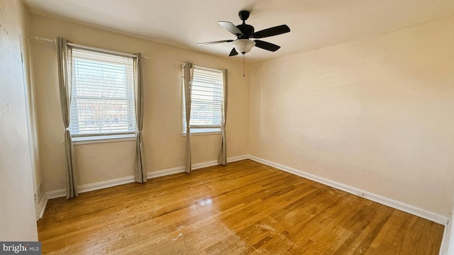 unfurnished room with ceiling fan and light wood-type flooring