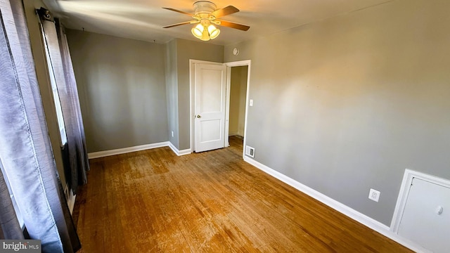 unfurnished room featuring hardwood / wood-style flooring and ceiling fan