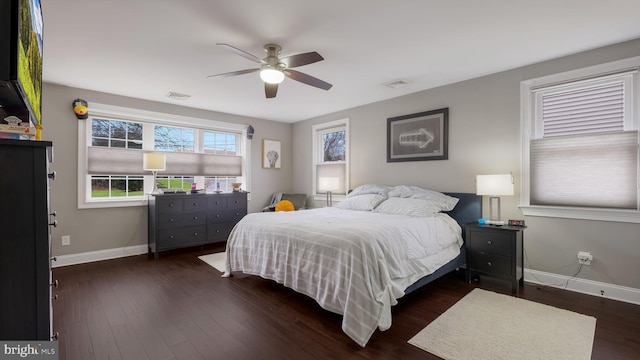 bedroom featuring dark wood-type flooring and ceiling fan