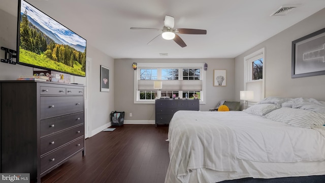 bedroom with dark wood-type flooring and ceiling fan