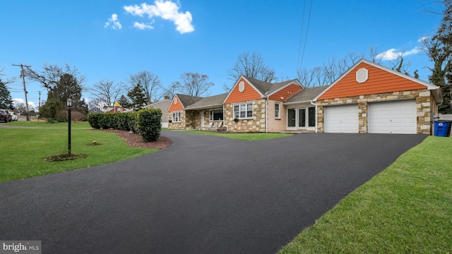 view of front of home with a garage and a front yard