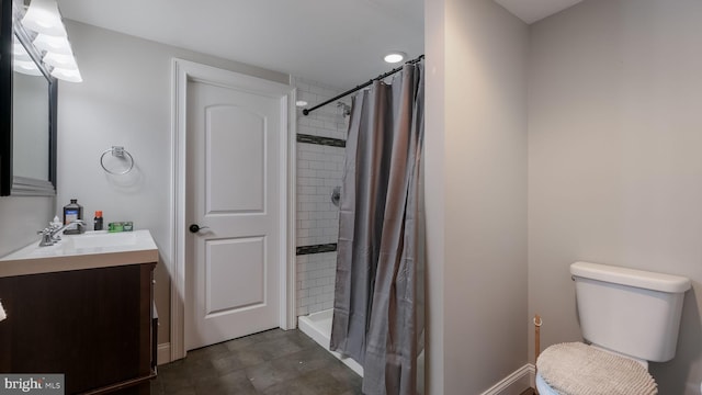 bathroom with walk in shower, vanity, and toilet