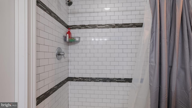 bathroom with a shower with shower curtain