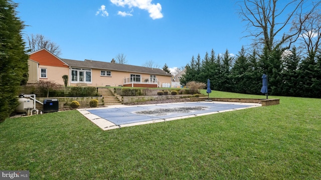 rear view of property with a patio area and a lawn