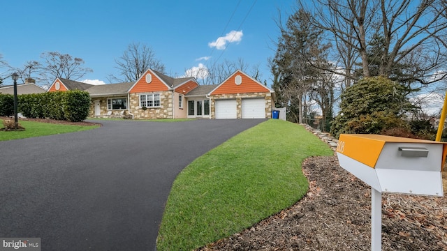 view of front of property featuring a garage and a front yard