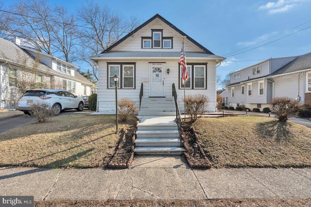 view of front of home with a front yard