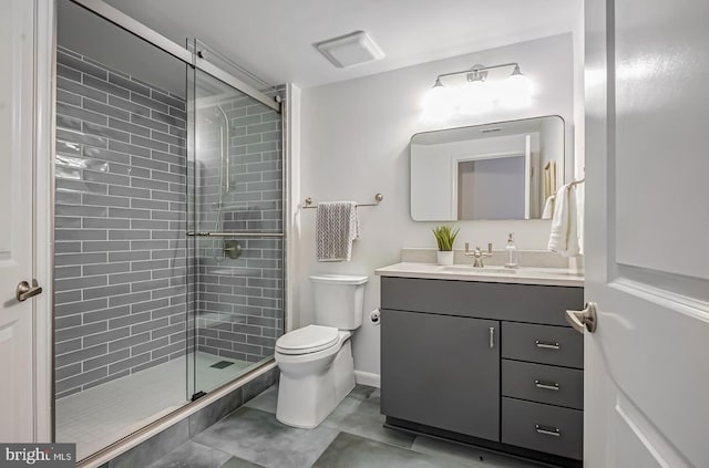 bathroom with vanity, an enclosed shower, and toilet