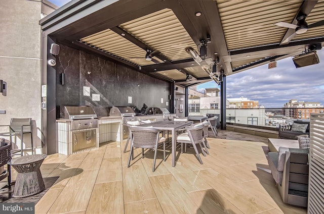 view of patio / terrace with area for grilling and ceiling fan