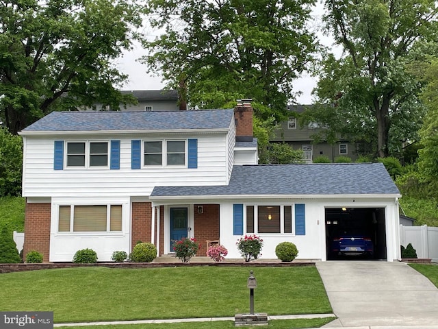 traditional-style home featuring an attached garage, a front lawn, concrete driveway, and brick siding