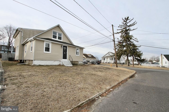 view of front of property featuring central AC unit