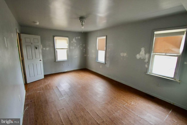 spare room featuring hardwood / wood-style flooring