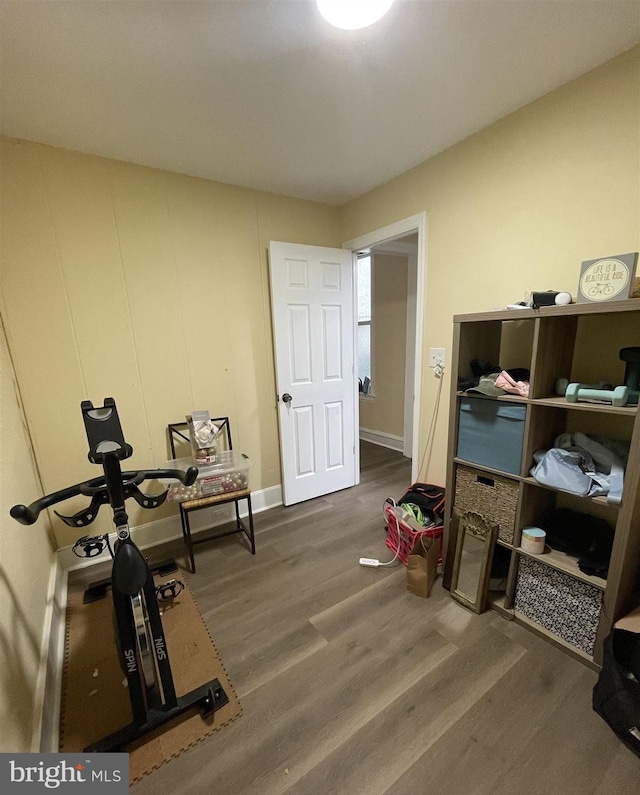 workout room with dark wood-type flooring