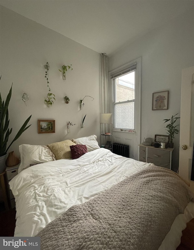 bedroom with radiator heating unit