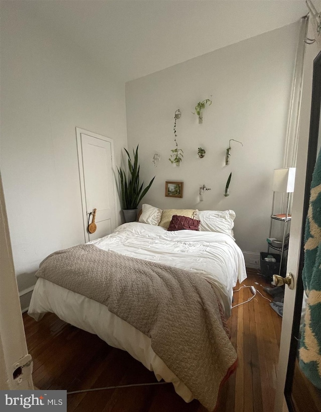 bedroom featuring dark hardwood / wood-style floors