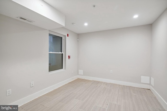 unfurnished room featuring light hardwood / wood-style flooring