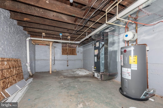 basement featuring heating unit and electric water heater