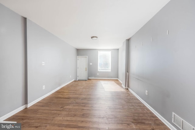 empty room featuring hardwood / wood-style flooring