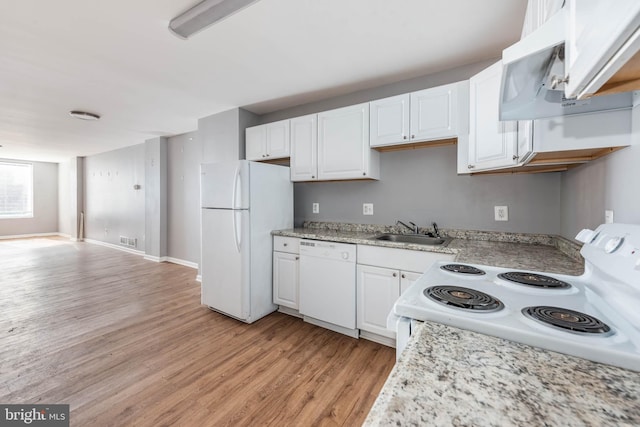 kitchen with white appliances, light hardwood / wood-style floors, sink, and white cabinets