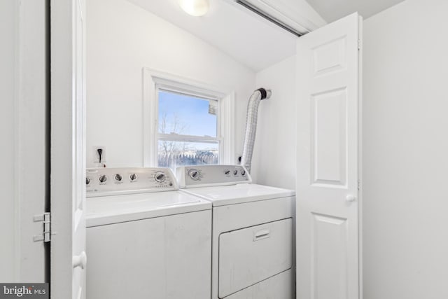 laundry area with laundry area and washer and clothes dryer