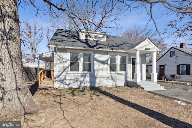 view of front of home featuring a shingled roof