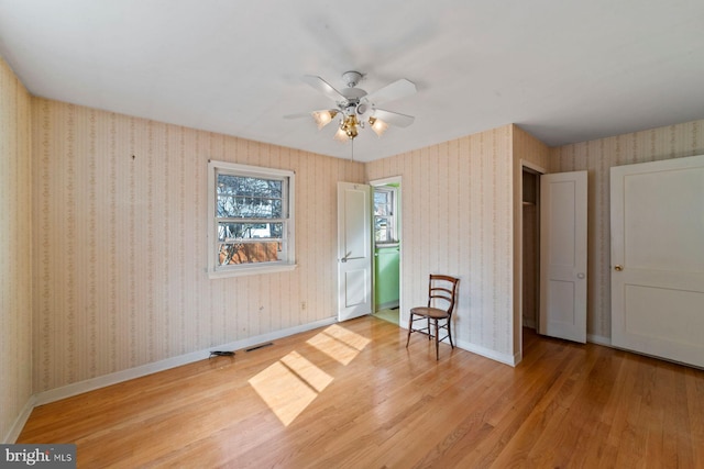 interior space with ceiling fan and light hardwood / wood-style floors