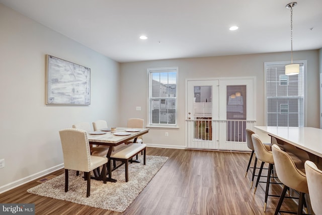 dining area with dark hardwood / wood-style flooring