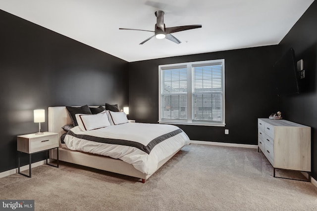 bedroom with light colored carpet and ceiling fan