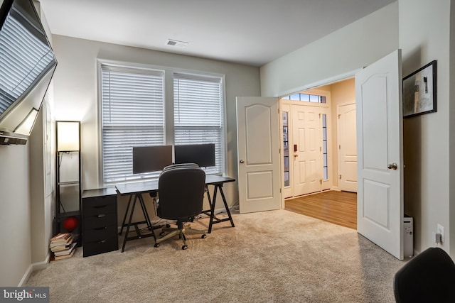 office space with light colored carpet