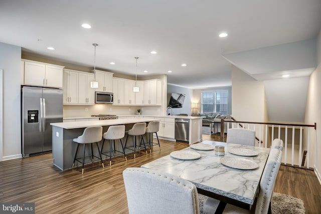 dining room with hardwood / wood-style floors