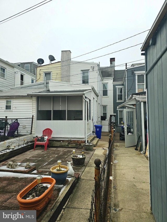 exterior space featuring a sunroom