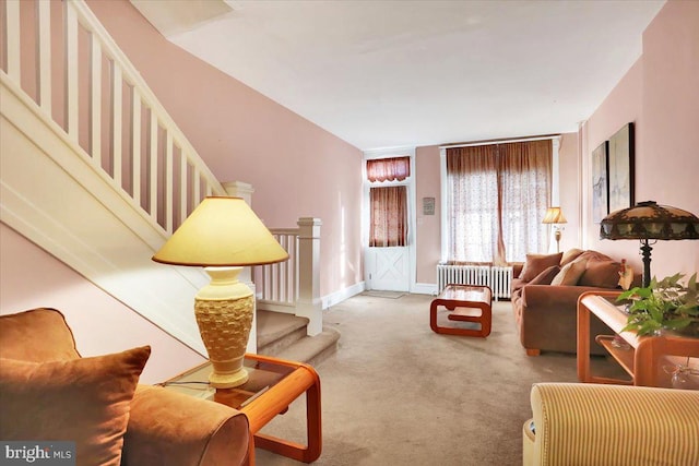 living room featuring carpet and radiator heating unit