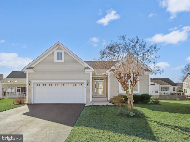 view of front facade featuring a front lawn and a garage