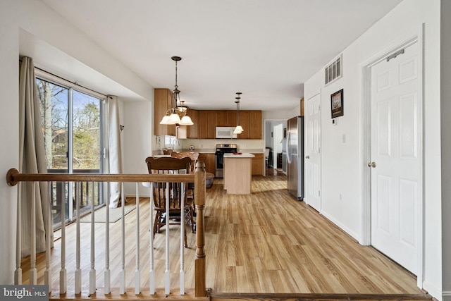 dining space featuring light hardwood / wood-style flooring