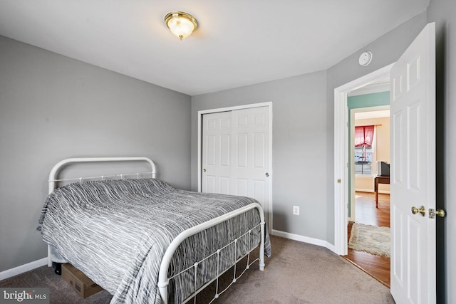 carpeted bedroom with a closet