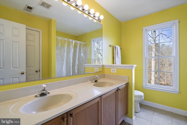 bathroom featuring vanity, tile patterned floors, toilet, and a shower with shower curtain