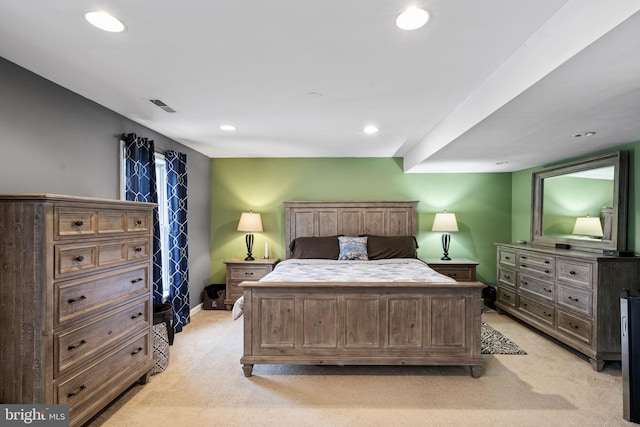 bedroom featuring light carpet