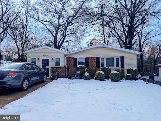 view of front of house featuring brick siding