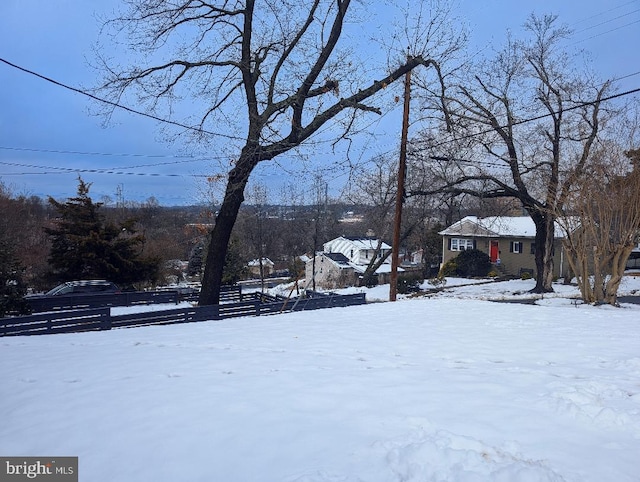 view of yard layered in snow