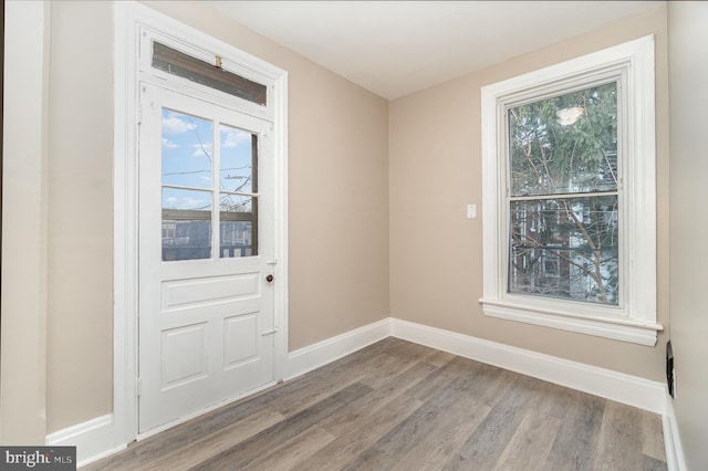 doorway to outside with hardwood / wood-style floors