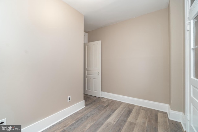 unfurnished room with light wood-type flooring