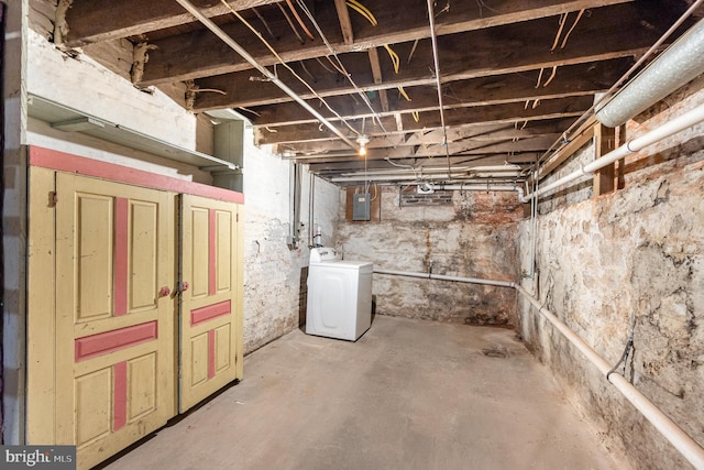 basement featuring washer / clothes dryer and electric panel