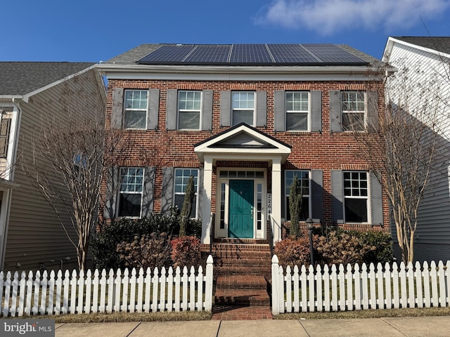 view of front of house with solar panels