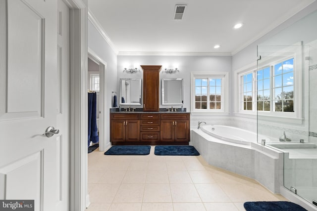 full bath featuring ornamental molding, visible vents, a sink, and a garden tub