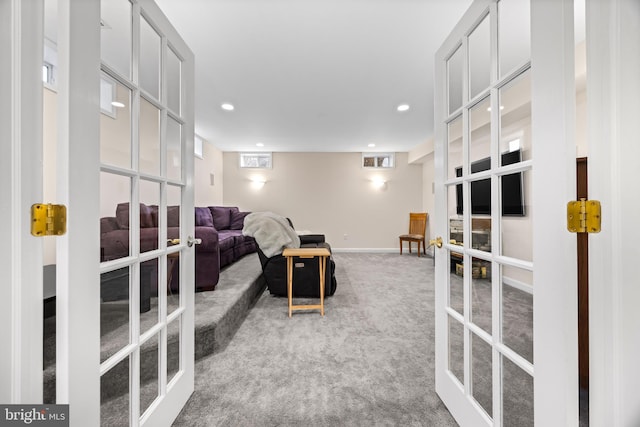 carpeted living room featuring recessed lighting, french doors, and baseboards