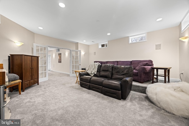 carpeted living area featuring baseboards, french doors, and recessed lighting